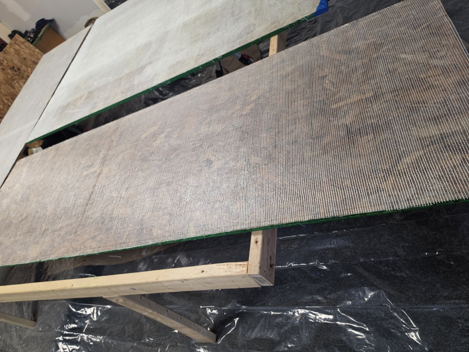 Fiberglass square mesh reinforcement in Brickyard shower panel construction